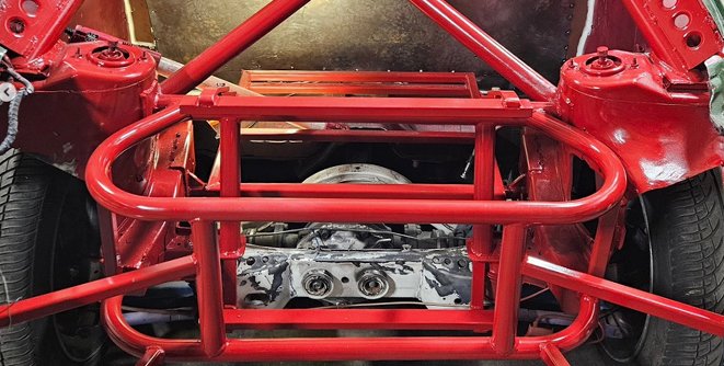 A custom, red frame fabrication built by Jon Waterfield
