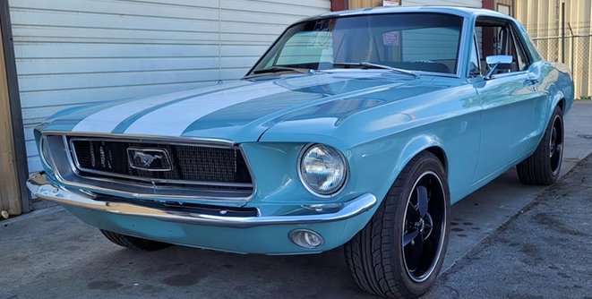 A restored blue Mustang Coupe